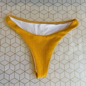 Bikini bottom size small. Mustard color.